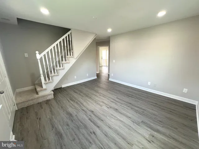 a view of an entryway with wooden floor