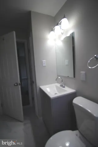 a bathroom with a toilet and a bath tub