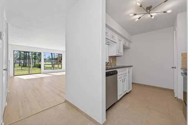 a kitchen with a stove a sink and a refrigerator