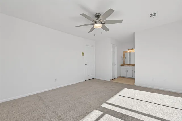 a view of a livingroom with a ceiling fan