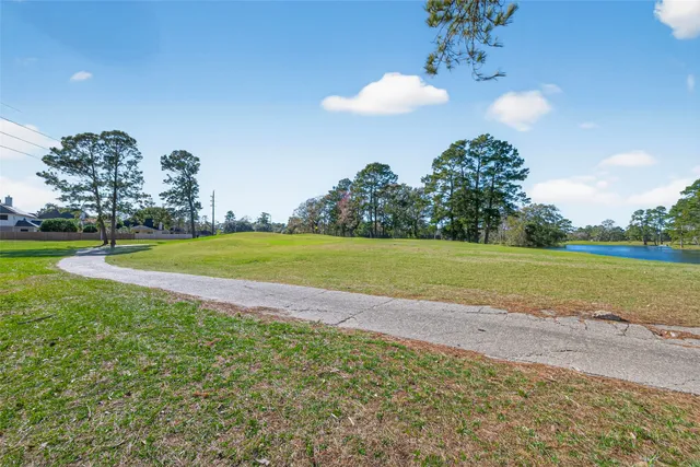 a view of a golf course with a lake