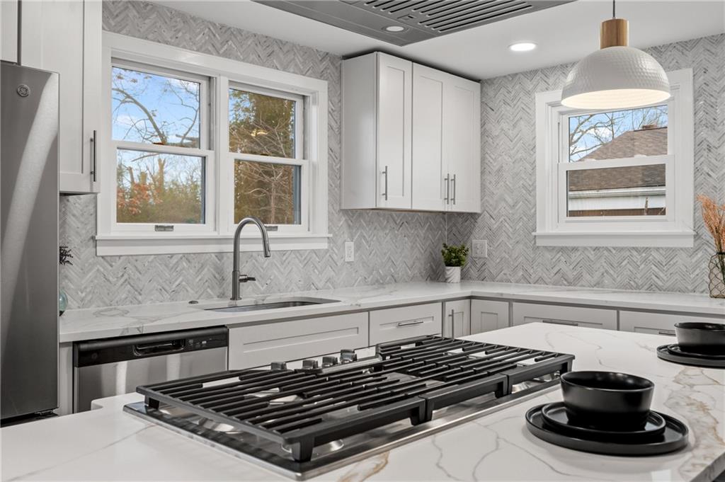 107 Marlboro Road Pittsburgh, PA 15238 - Photo 14 of 45 a kitchen with granite countertop a stove and a sink