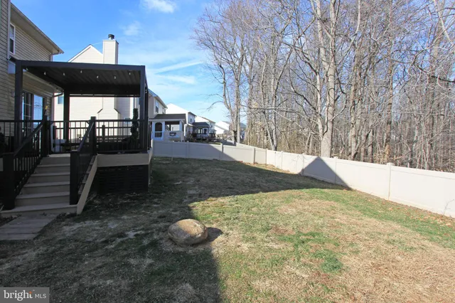 a view of a backyard of the house