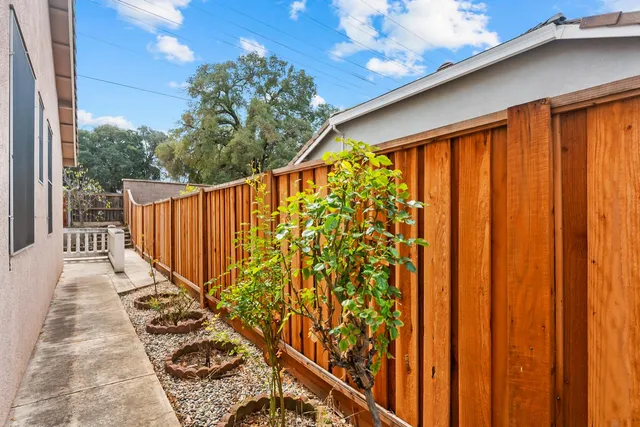 a view of a porch with wooden fence