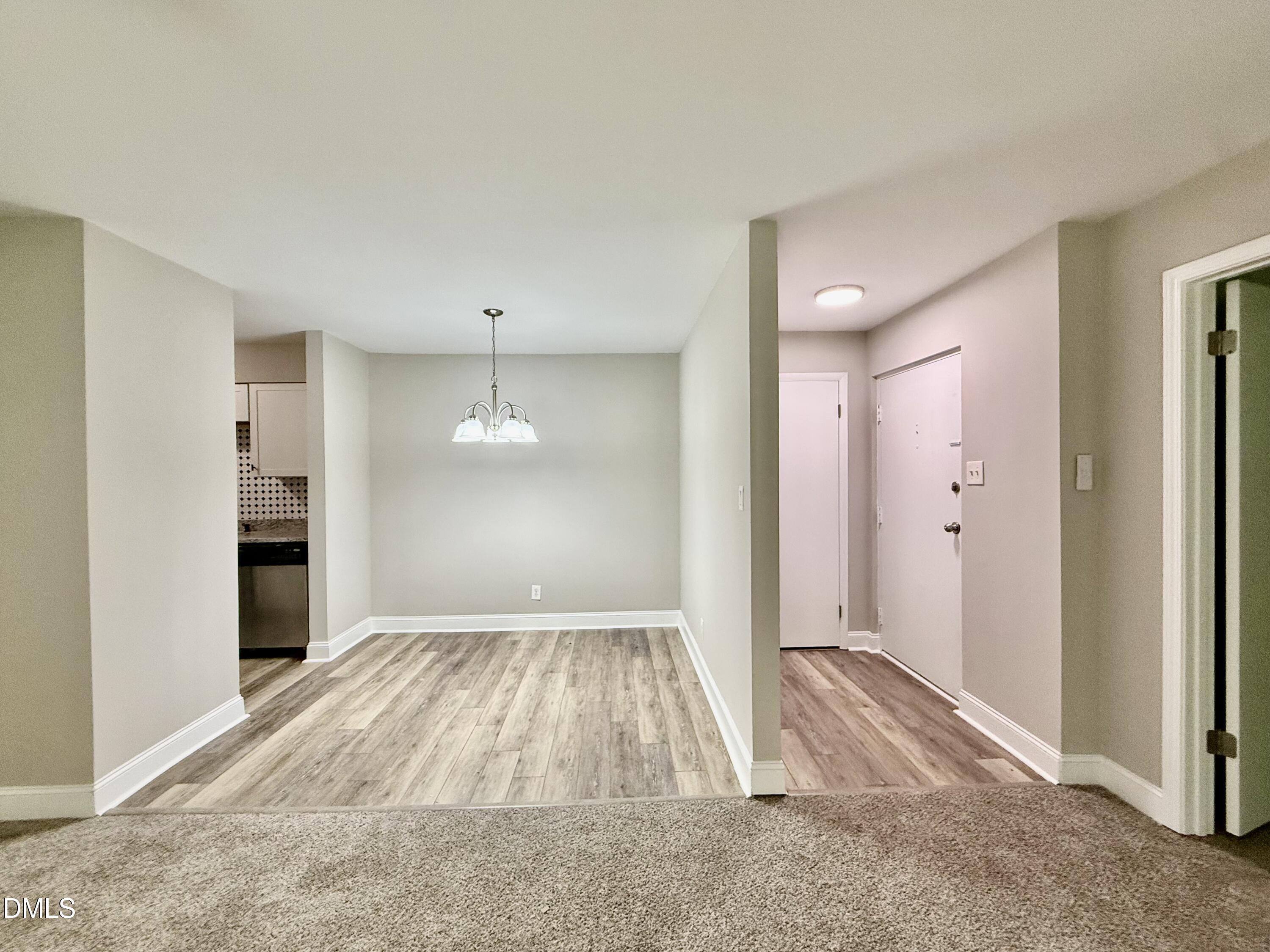 1114 Schaub Drive, Unit I Raleigh, NC 27606 - Photo 2 of 9 a bedroom with a bed and a window