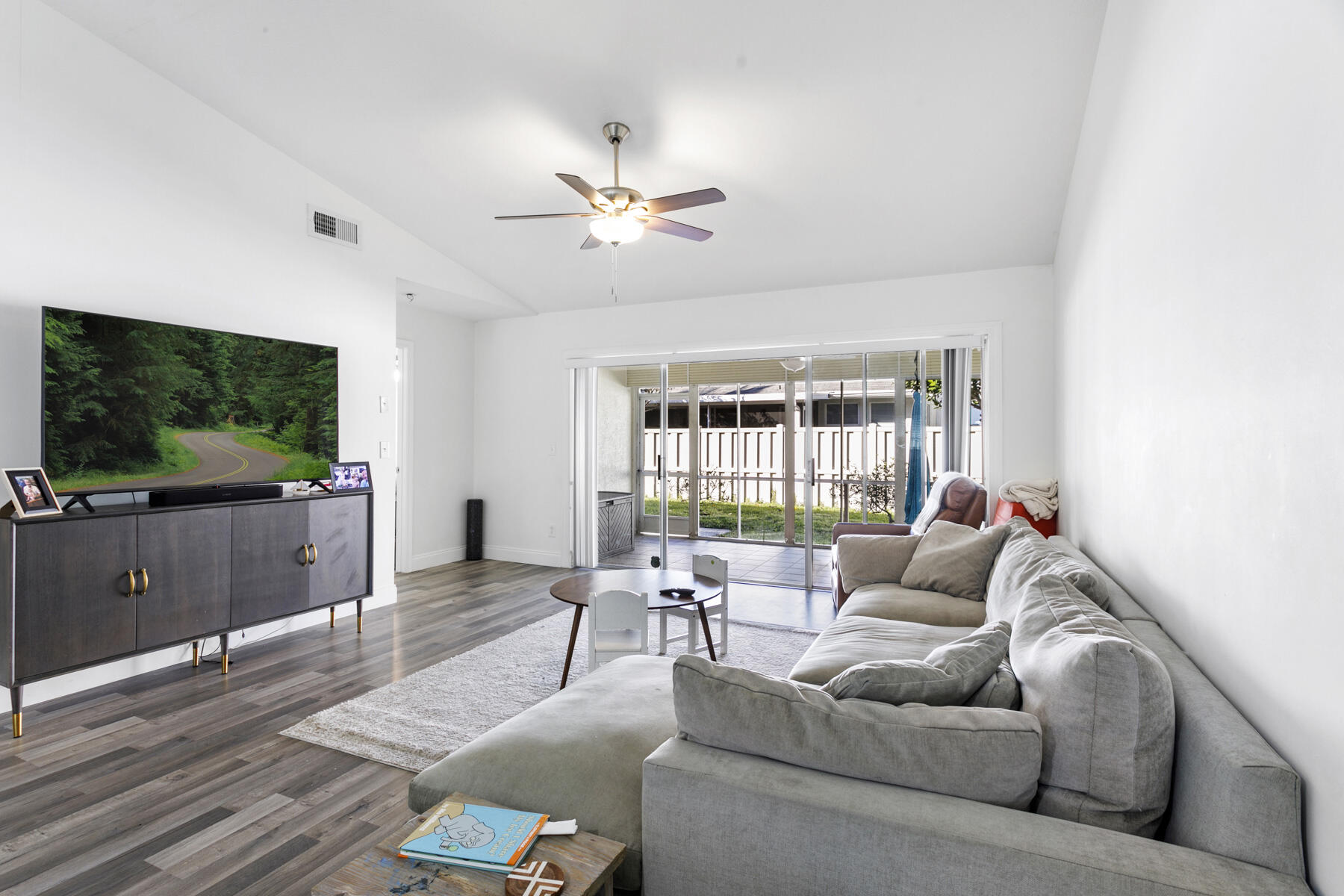 140 Moccasin Trail South Jupiter, FL 33458 - Photo 7 of 18 a living room with furniture and a flat screen tv