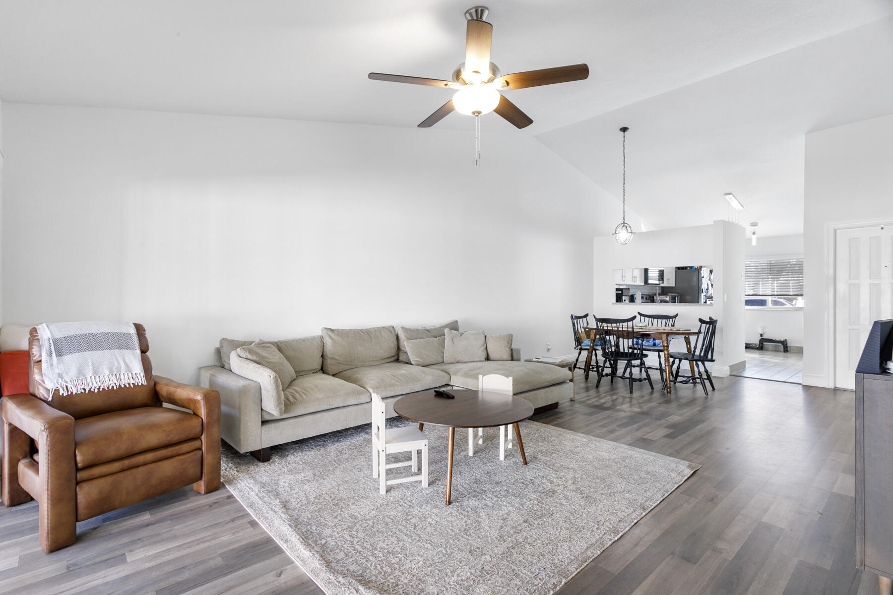 140 Moccasin Trail South Jupiter, FL 33458 - Photo 8 of 18 a living room with furniture and wooden floor