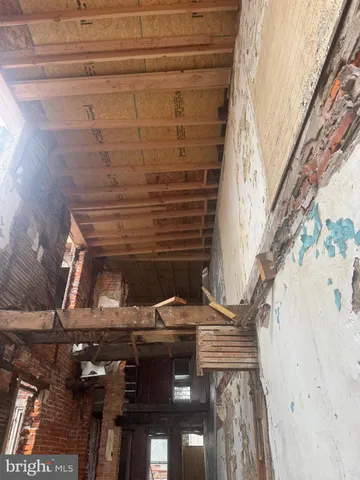 a view of staircase with a white door