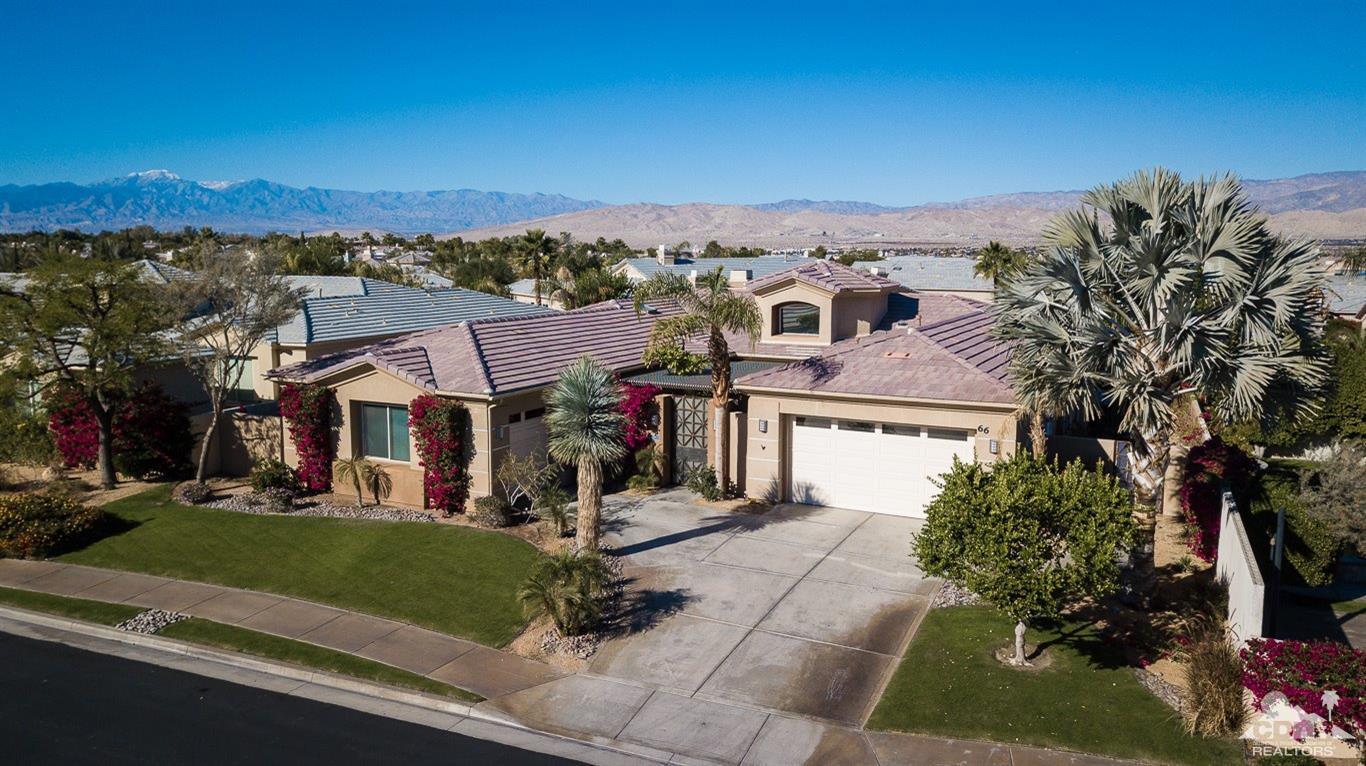 66 Paris Way Rancho Mirage, CA 92270 - Photo 1 of 32 an aerial view of a residential apartment building with a yard and parking space