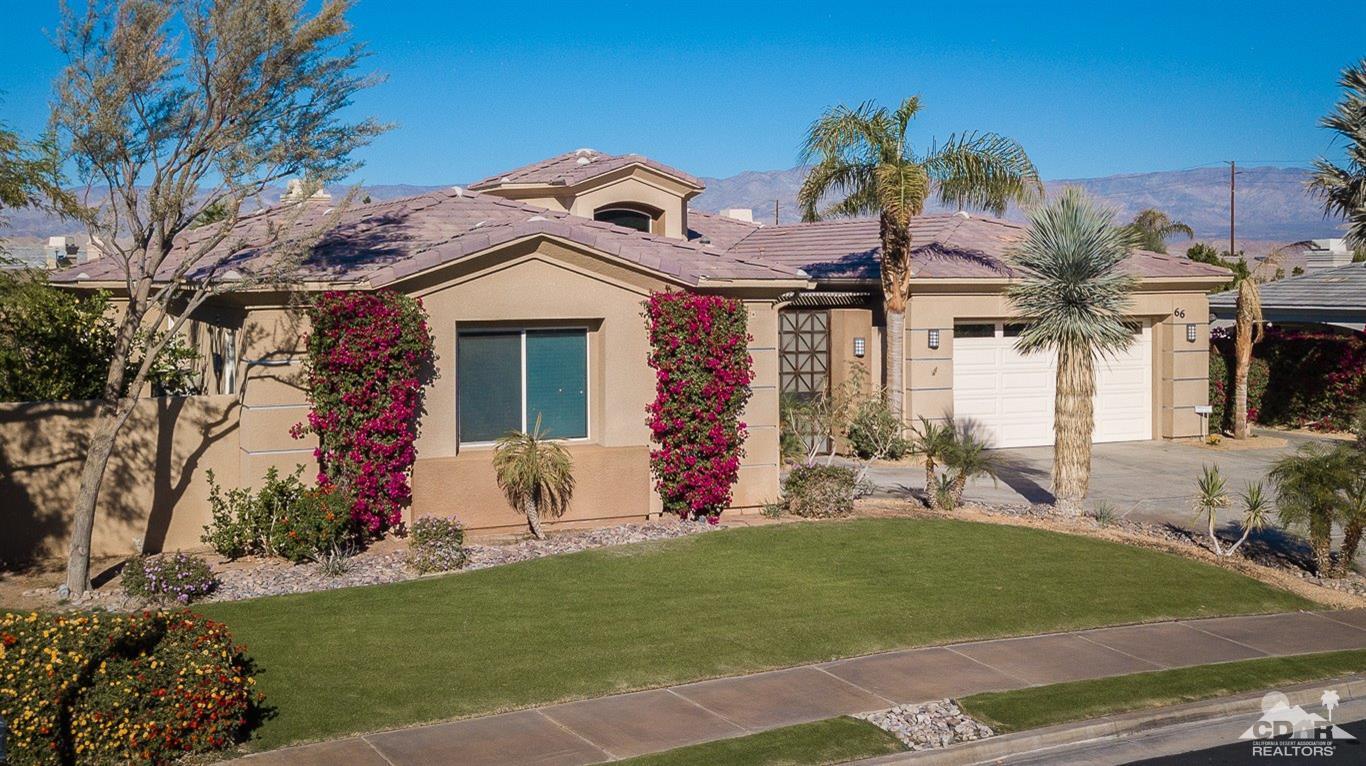 66 Paris Way Rancho Mirage, CA 92270 - Photo 2 of 32 a front view of a house with garden