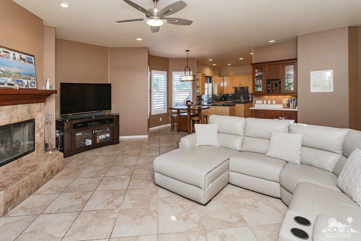 66 Paris Way Rancho Mirage, CA 92270 - Photo 11 of 32 a living room with furniture and a flat screen tv