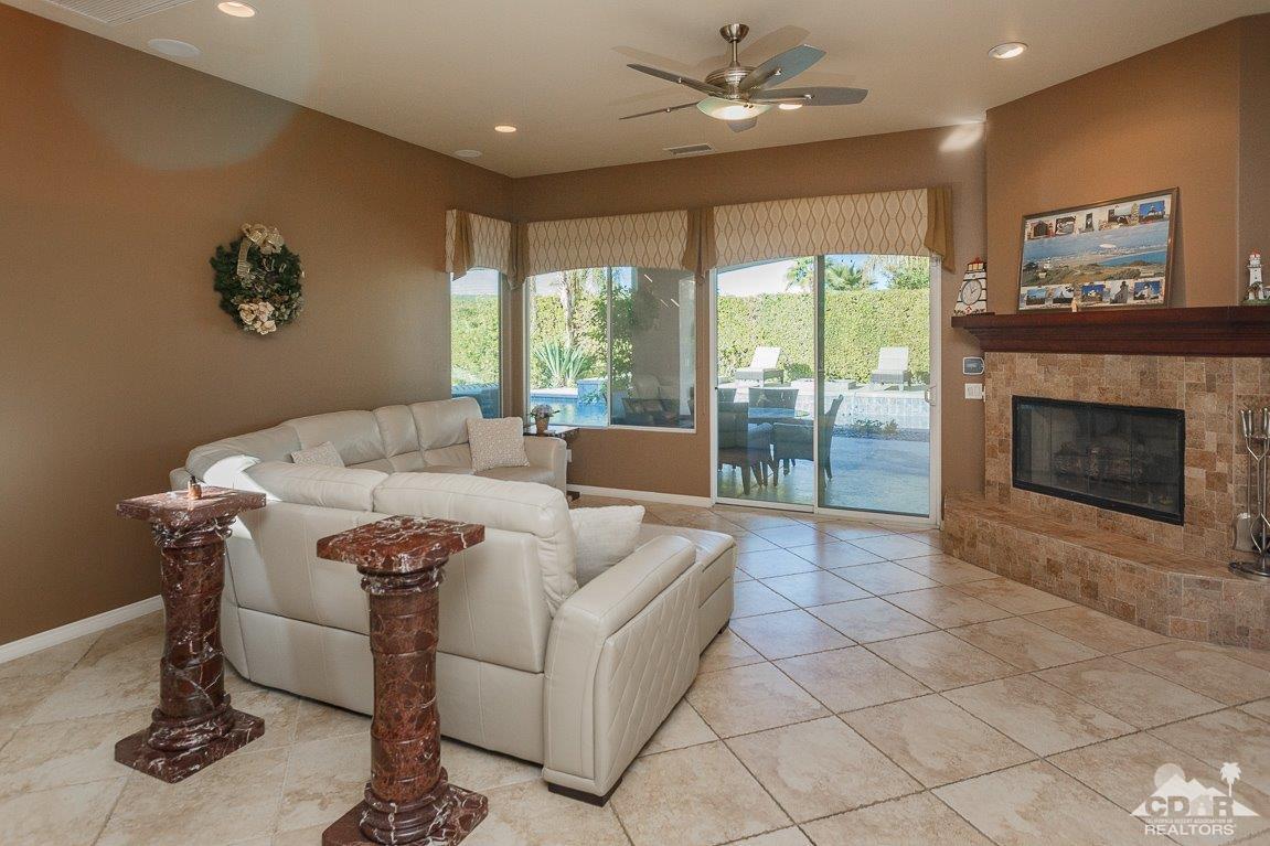 66 Paris Way Rancho Mirage, CA 92270 - Photo 12 of 32 a living room with furniture and a fireplace