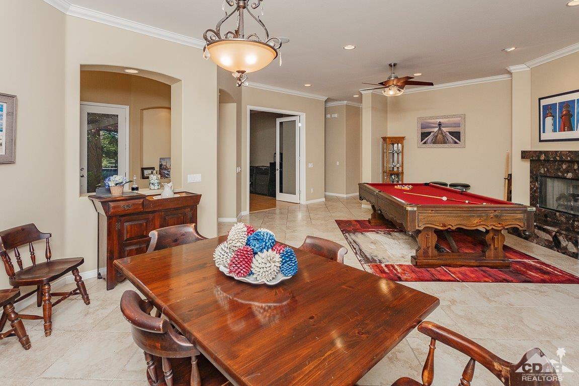66 Paris Way Rancho Mirage, CA 92270 - Photo 17 of 32 a living room with furniture and wooden floor