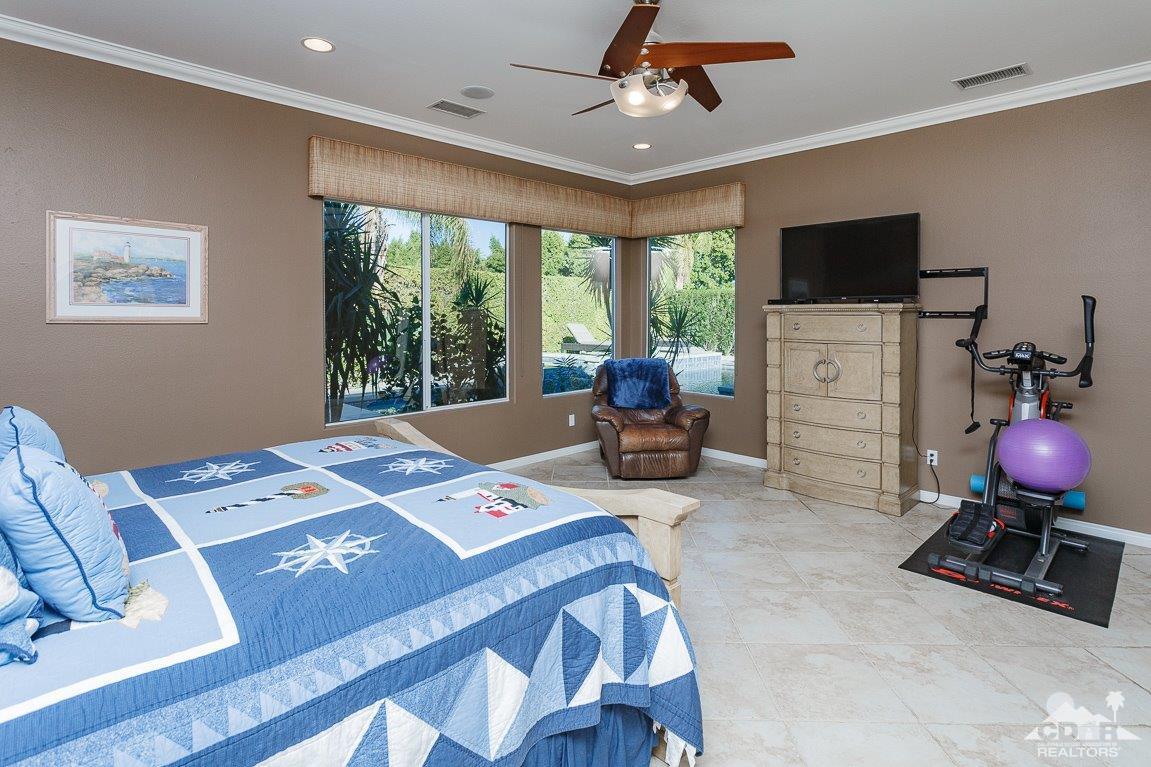 66 Paris Way Rancho Mirage, CA 92270 - Photo 18 of 32 a workspace with furniture and window