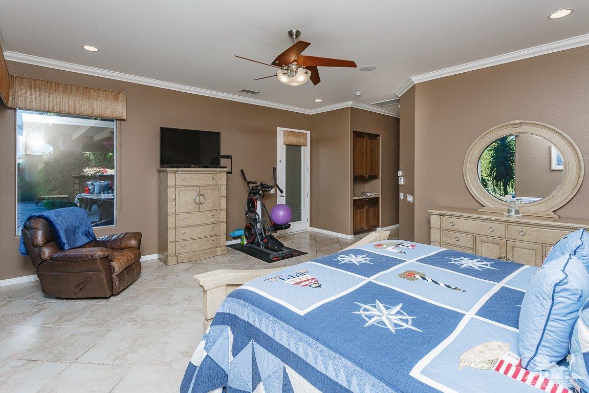 66 Paris Way Rancho Mirage, CA 92270 - Photo 19 of 32 a living room with furniture and a flat screen tv