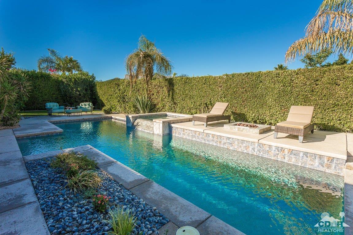 66 Paris Way Rancho Mirage, CA 92270 - Photo 24 of 32 a view of a swimming pool with a patio