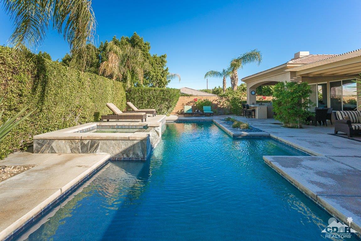 66 Paris Way Rancho Mirage, CA 92270 - Photo 27 of 32 a view of a house with pool and chairs