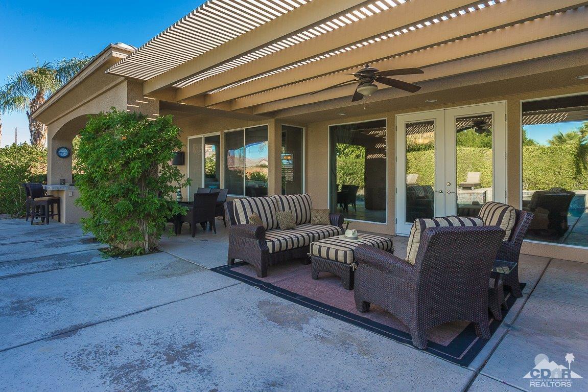 66 Paris Way Rancho Mirage, CA 92270 - Photo 29 of 32 a view of living room filled with furniture and a potted plant