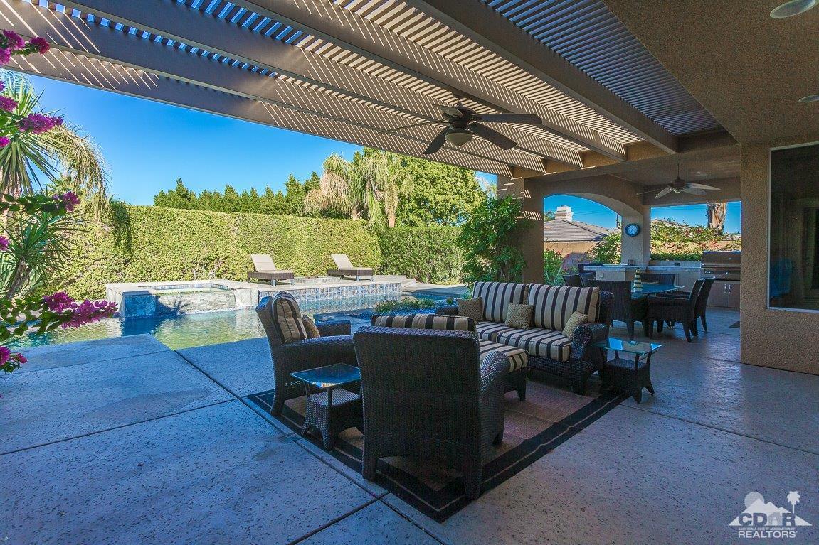 66 Paris Way Rancho Mirage, CA 92270 - Photo 30 of 32 a view of a patio with a table chairs and a patio