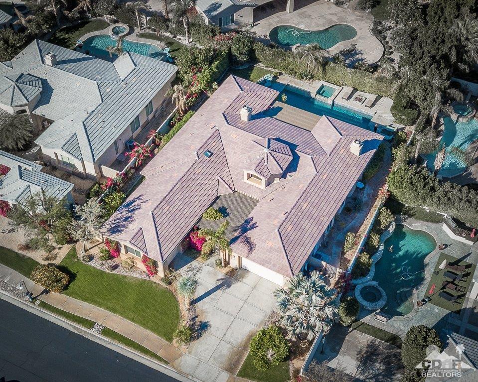66 Paris Way Rancho Mirage, CA 92270 - Photo 4 of 32 an aerial view of a house with a garden and trees