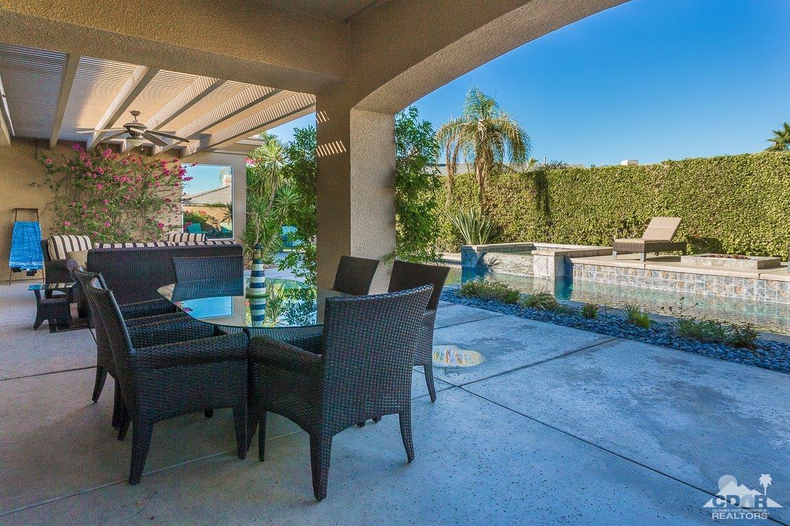 66 Paris Way Rancho Mirage, CA 92270 - Photo 31 of 32 a view of a porch with furniture and yard