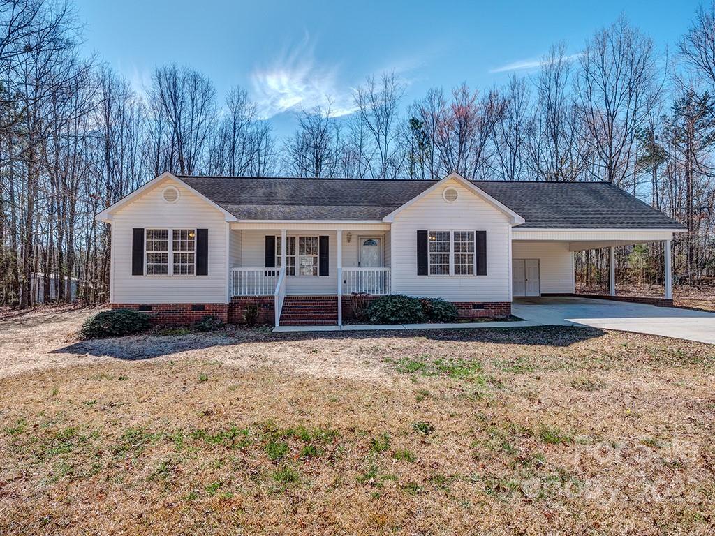 3488 State Rd S-29-330 Lancaster, SC 29720 - Photo 1 of 25 a front view of a house with a yard