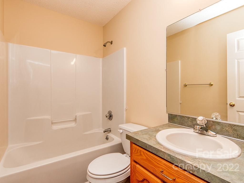 3488 State Rd S-29-330 Lancaster, SC 29720 - Photo 20 of 25 a bathroom with a granite countertop sink toilet mirror and shower