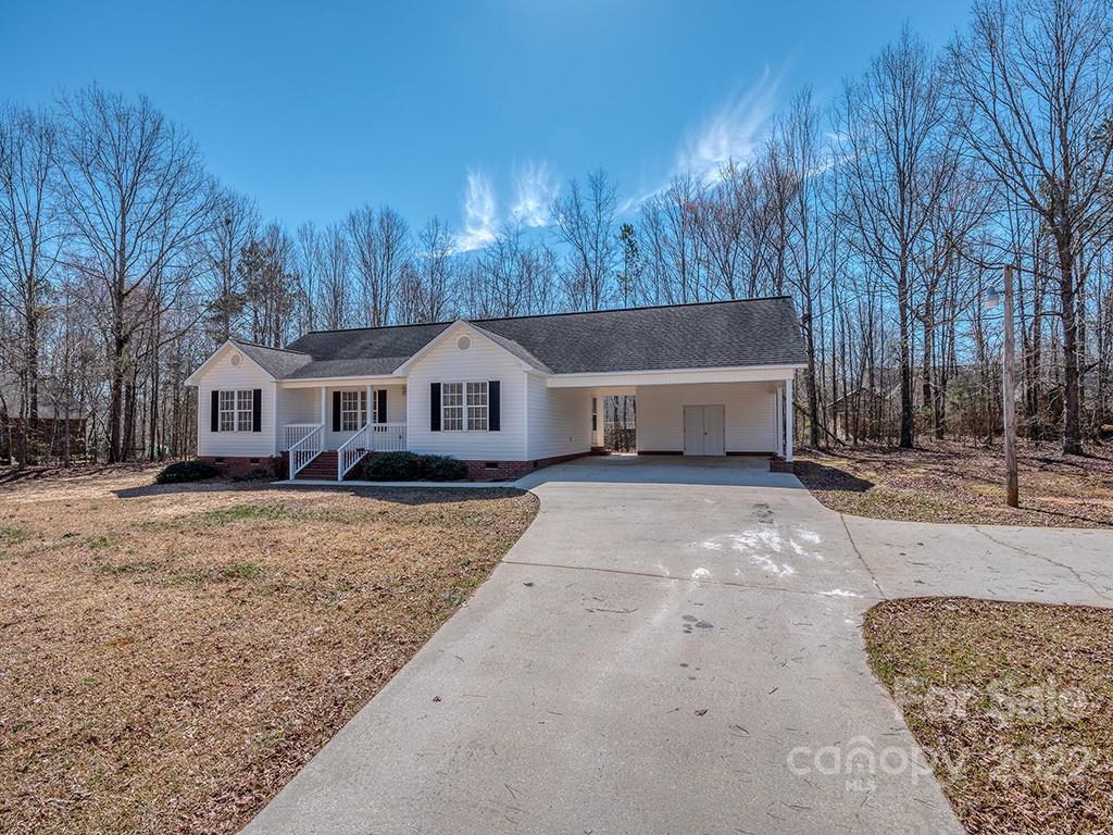 3488 State Rd S-29-330 Lancaster, SC 29720 - Photo 2 of 25 a front view of a house with a yard