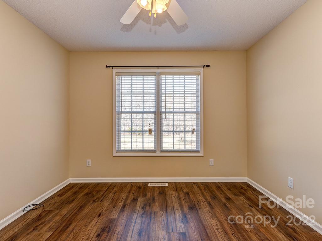 3488 State Rd S-29-330 Lancaster, SC 29720 - Photo 21 of 25 an empty room with wooden floor and windows