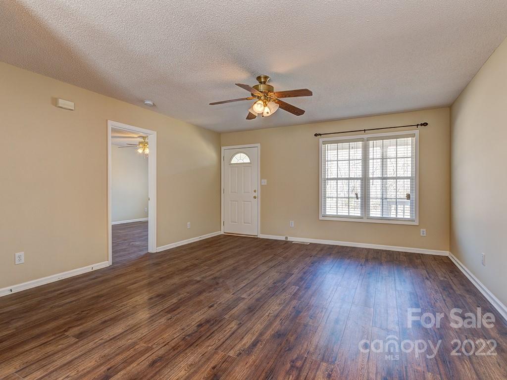 3488 State Rd S-29-330 Lancaster, SC 29720 - Photo 4 of 25 wooden floor in an empty room with a window