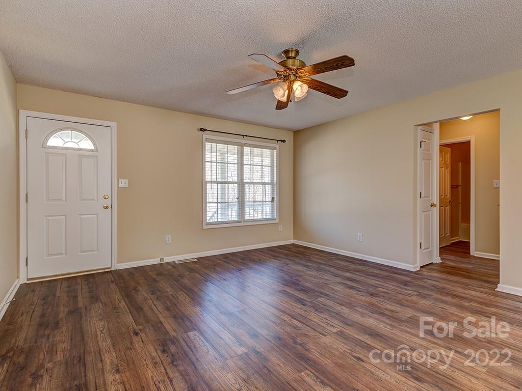 3488 State Rd S-29-330 Lancaster, SC 29720 - Photo 5 of 25 a view of an empty room with wooden floor and a window