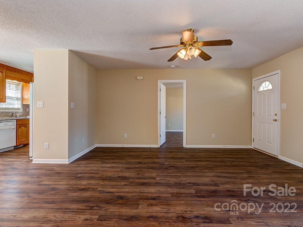 3488 State Rd S-29-330 Lancaster, SC 29720 - Photo 6 of 25 a view of an empty room with wooden floor and a window