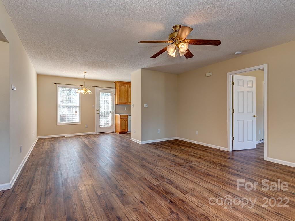 3488 State Rd S-29-330 Lancaster, SC 29720 - Photo 7 of 25 a view of an empty room with wooden floor and a window