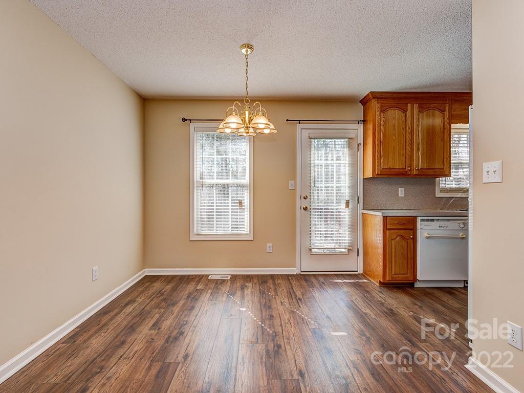 3488 State Rd S-29-330 Lancaster, SC 29720 - Photo 9 of 25 an empty room with a windows and chandelier