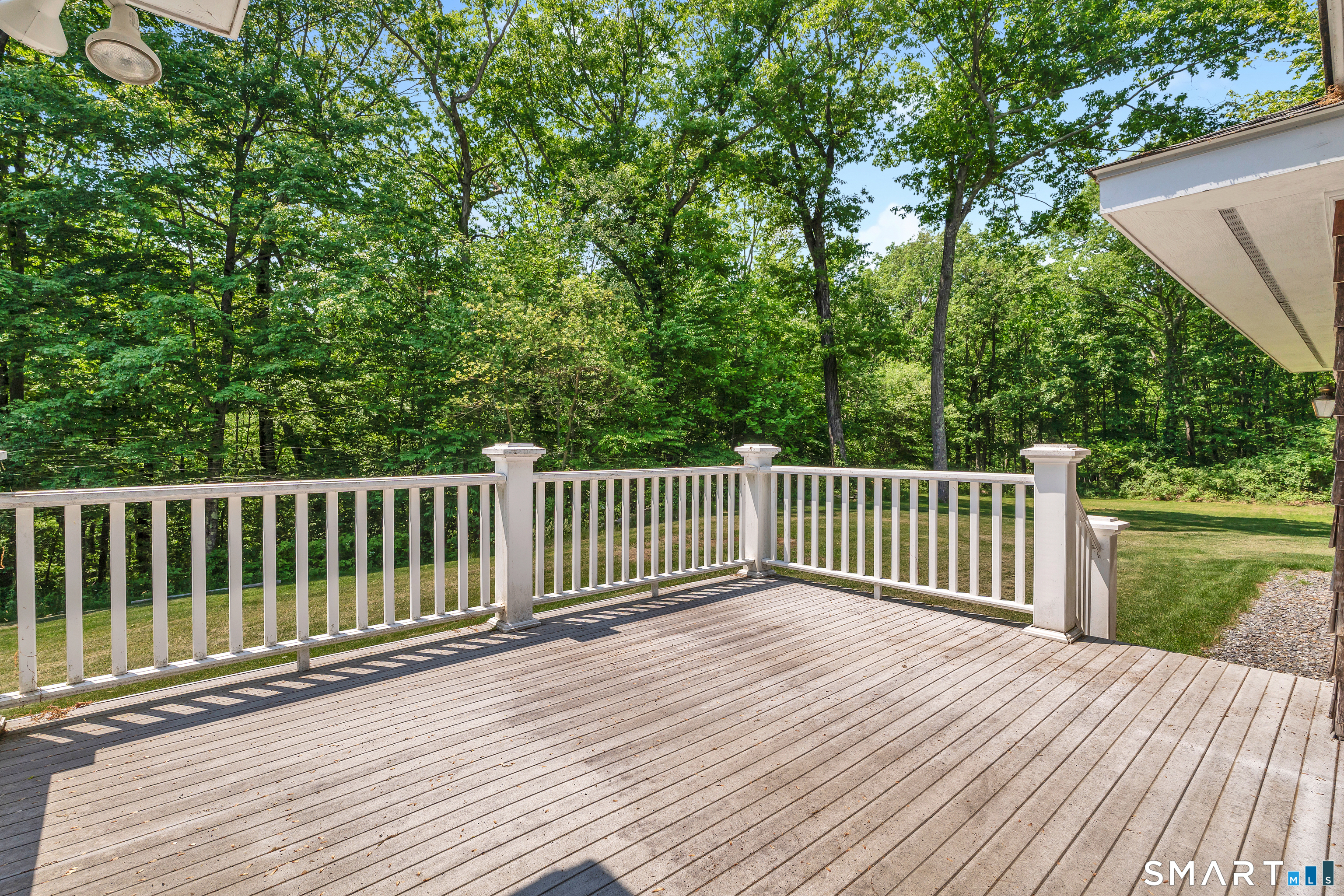 30 Maltbie Road Newtown, CT 06470 - Photo 12 of 40 a view of balcony with wooden floor and fence