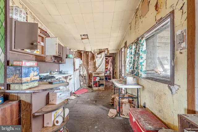 a workspace with furniture and a kitchen