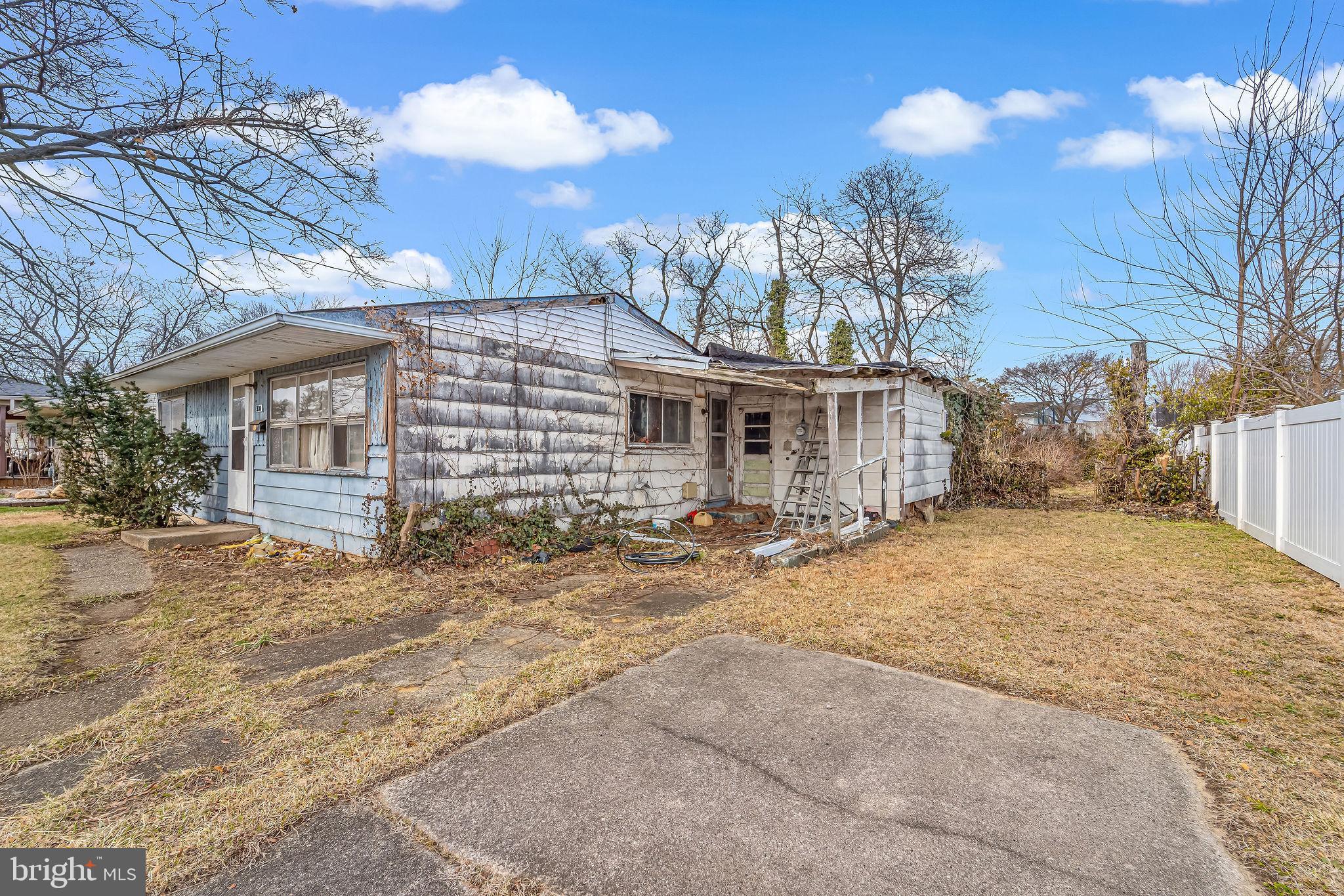 331 Collins Lane Maple Shade, NJ 08052 - Photo 5 of 17 a front view of a house with a yard and garage