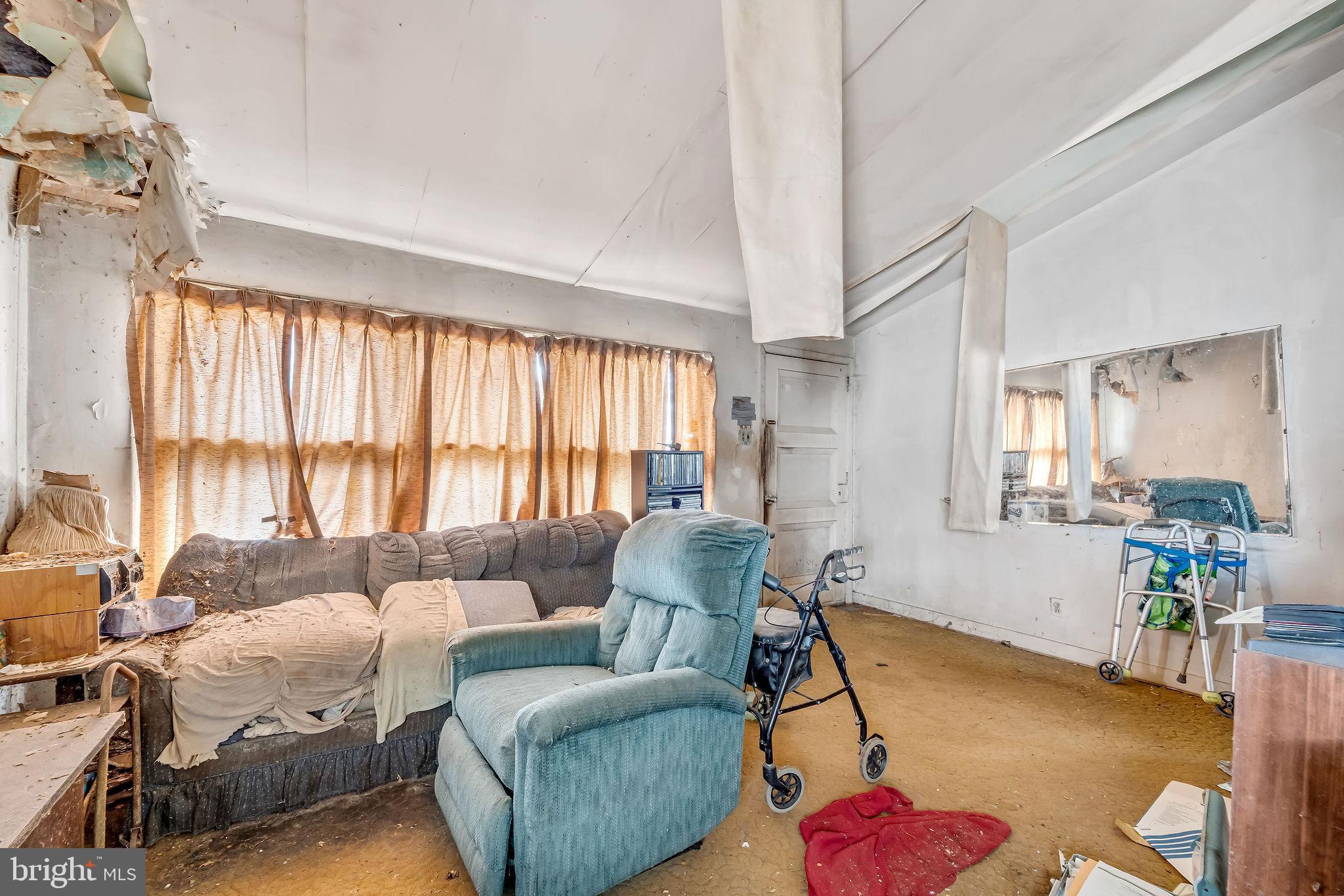 331 Collins Lane Maple Shade, NJ 08052 - Photo 9 of 17 a living room with furniture and a large window