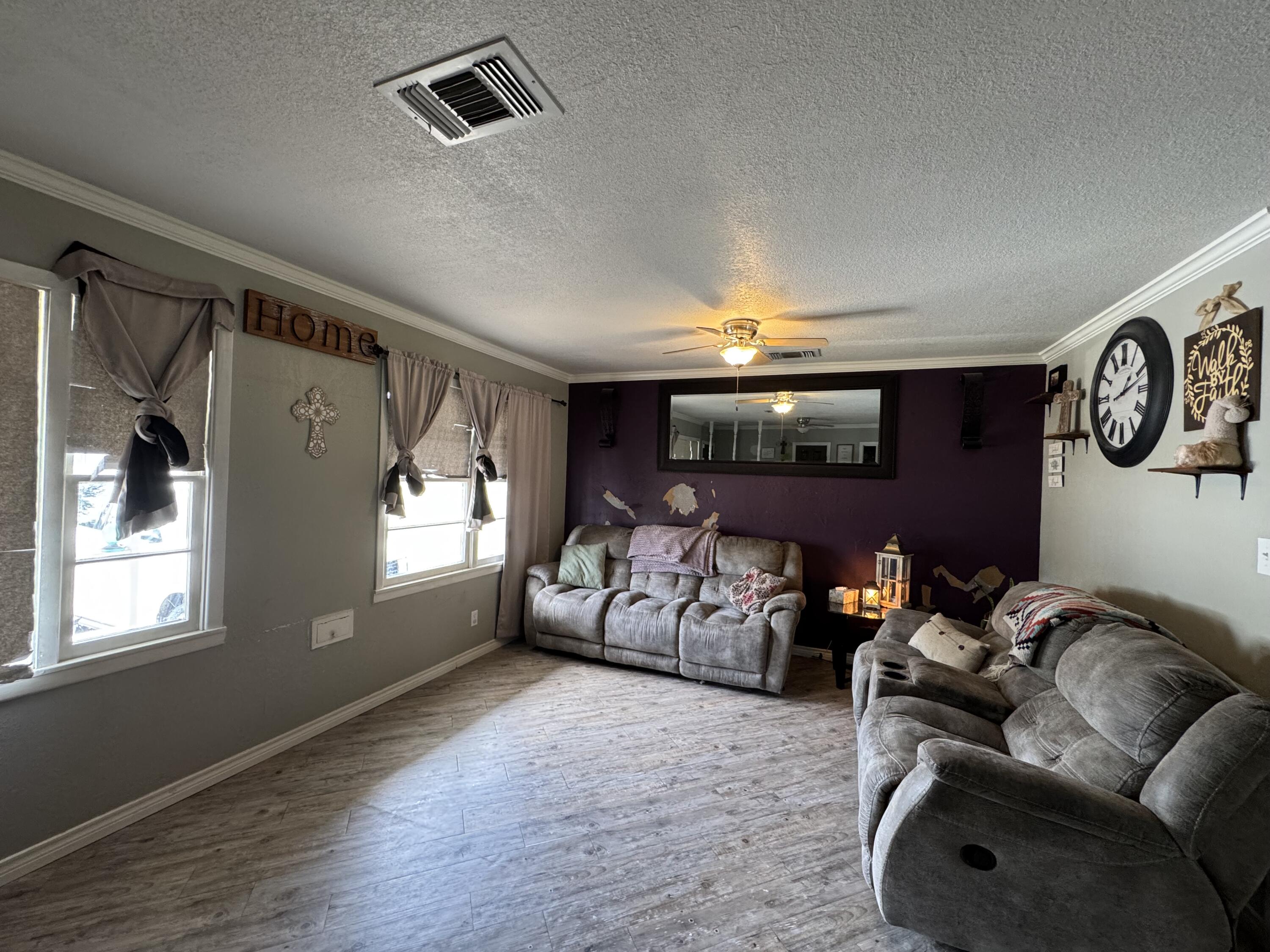 3808 37th Street Lubbock, TX 79413 - Photo 2 of 19 a living room with furniture and a window