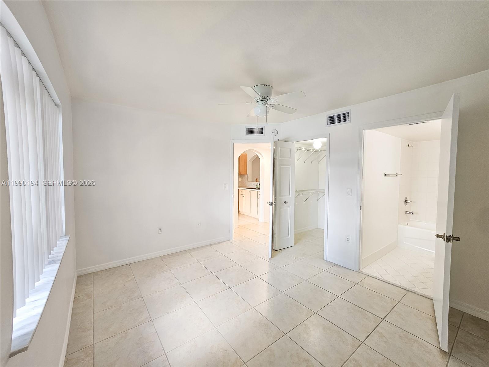 2651 Southeast 12th Road, Unit 105 Homestead, FL 33035 - Photo 12 of 24 a view of a kitchen with a refrigerator and a sink
