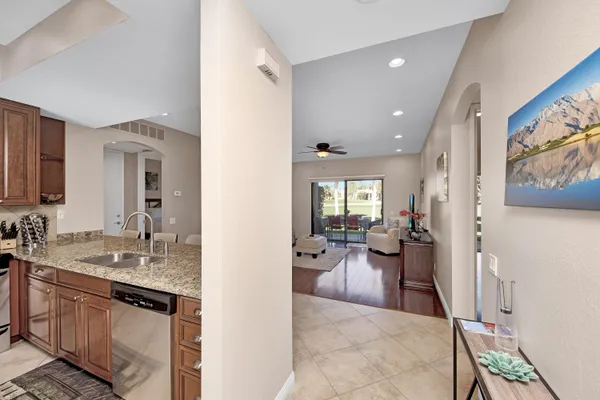 a view of a living room and a wooden floor