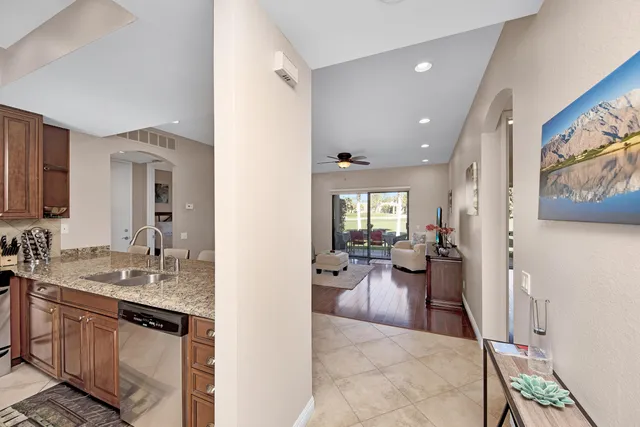 a view of a living room and a wooden floor