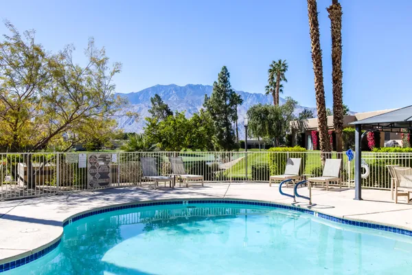 a view of a swimming pool with a patio