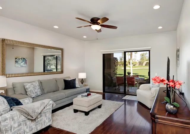 a living room with furniture and a large window