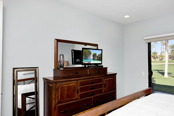 a living room with furniture and flat screen tv