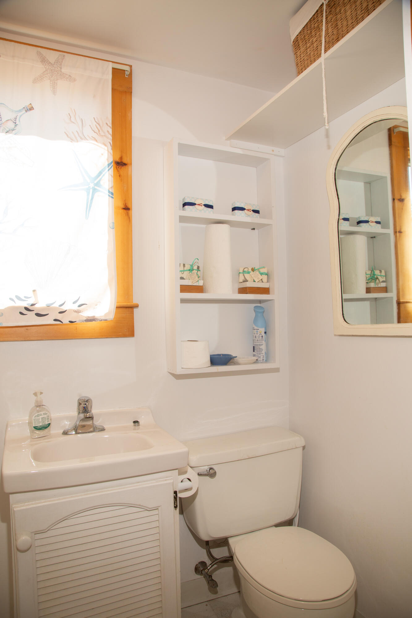 10 Wixon Road Dennis Port, MA 02639 - Photo 15 of 25 a bathroom with a toilet a sink and a window