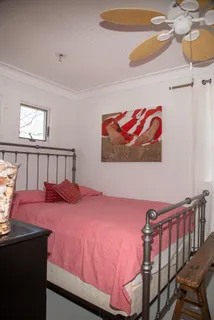 a bedroom with a bed and dresser