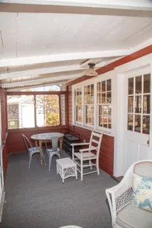 a dining room with furniture and windows