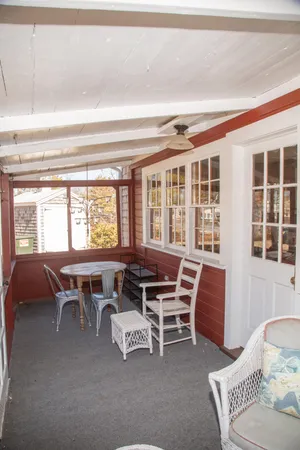 a dining room with furniture and windows