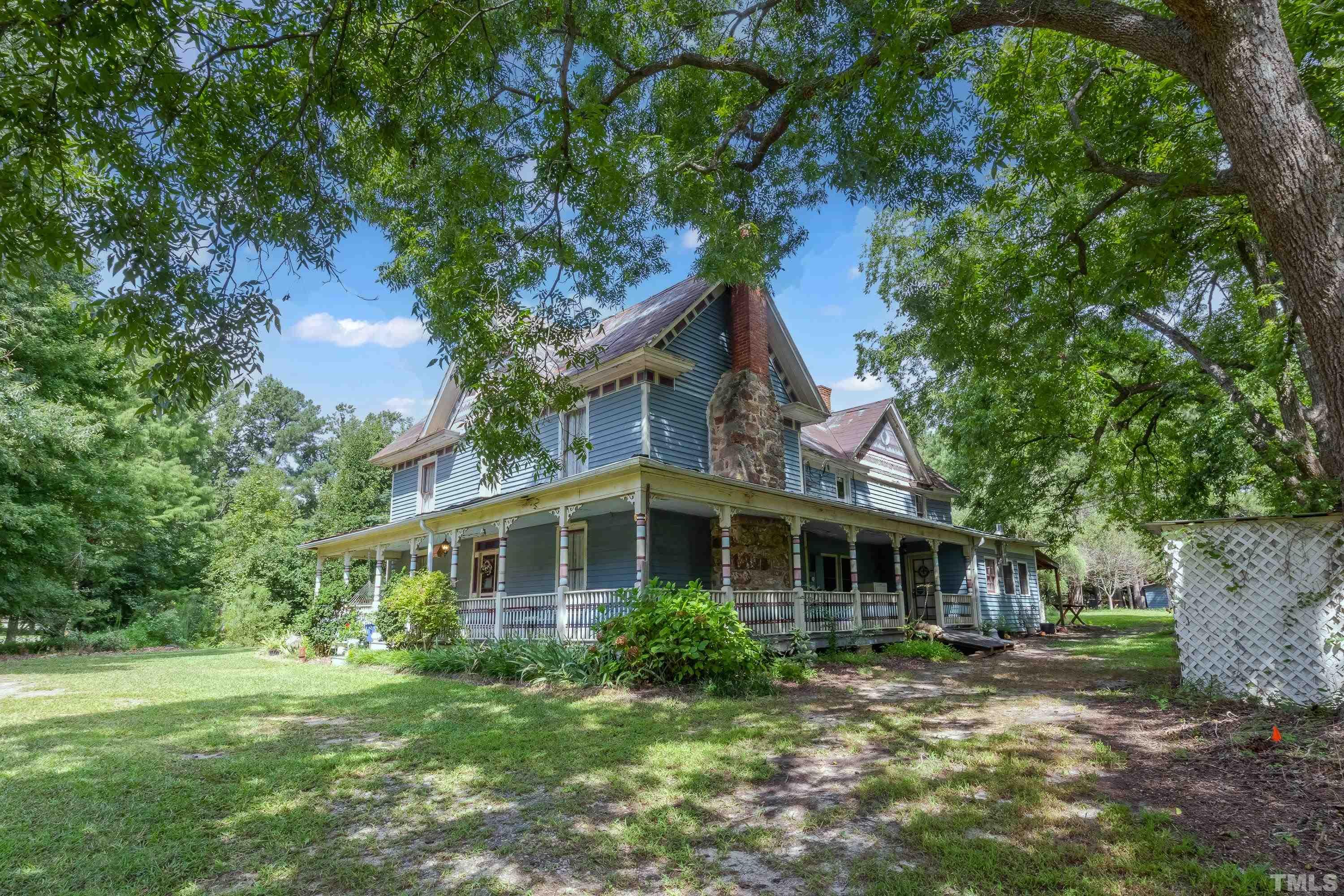 3614 Carpenter Pond Road Durham, NC 27703 - Photo 4 of 57 a front view of a house with a garden